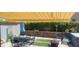 Relaxing backyard featuring a covered patio, dining, and lush greenery at 9417 Sand Tiger Ave, Las Vegas, NV 89148