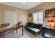 Bright bedroom with a futon, desk, and window for a versatile space at 9417 Sand Tiger Ave, Las Vegas, NV 89148