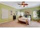 Main bedroom with a ceiling fan and decorative elements at 9417 Sand Tiger Ave, Las Vegas, NV 89148