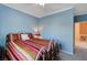 Bedroom with light blue walls and metal bed frame at 9417 Sand Tiger Ave, Las Vegas, NV 89148