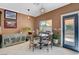 Charming breakfast nook with a table and chairs, near sliding glass door at 9417 Sand Tiger Ave, Las Vegas, NV 89148