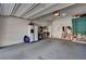 Spacious garage with a fridge, storage, and ample room for parking at 9417 Sand Tiger Ave, Las Vegas, NV 89148