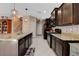 Spacious kitchen with granite countertops and dark wood cabinets at 9417 Sand Tiger Ave, Las Vegas, NV 89148