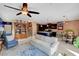 Open living space with a blue accent wall, and stairs leading upstairs at 9417 Sand Tiger Ave, Las Vegas, NV 89148