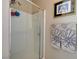 Bathroom featuring a glass enclosed shower and flower themed towels at 9417 Sand Tiger Ave, Las Vegas, NV 89148