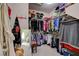 Walk-in closet with abundant shelving, clothing racks and mirror for dressing at 9417 Sand Tiger Ave, Las Vegas, NV 89148