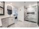 Elegant bathroom with a large marble shower, floating vanity, and stylish mirror at 10009 Cabernet Hills St, Las Vegas, NV 89141