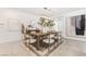 Modern dining room with wood table and statement artwork at 10009 Cabernet Hills St, Las Vegas, NV 89141