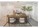 Modern dining room with wood table and statement artwork at 10009 Cabernet Hills St, Las Vegas, NV 89141