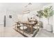 Modern dining room with wood table and statement artwork at 10009 Cabernet Hills St, Las Vegas, NV 89141