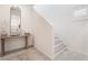 Bright entryway with staircase, mirror, and console table at 10009 Cabernet Hills St, Las Vegas, NV 89141