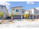 Two-story house with gray garage door and landscaped yard at 10009 Cabernet Hills St, Las Vegas, NV 89141