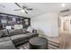 Gathering room features a sectional sofa, large TV, and built-in shelving at 10009 Cabernet Hills St, Las Vegas, NV 89141