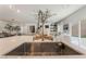 Modern kitchen features a large island with stainless steel sink and ample counter space at 10009 Cabernet Hills St, Las Vegas, NV 89141