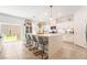 Modern kitchen with white cabinets, large island, and stainless steel appliances at 10009 Cabernet Hills St, Las Vegas, NV 89141