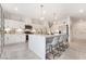 Modern kitchen with white cabinets, large island, and stainless steel appliances at 10009 Cabernet Hills St, Las Vegas, NV 89141