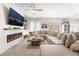 Spacious living room with sectional sofa and electric fireplace at 10009 Cabernet Hills St, Las Vegas, NV 89141