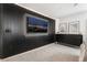 Main bedroom with large TV, dresser and stylish wall decor at 10009 Cabernet Hills St, Las Vegas, NV 89141