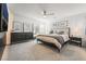 Main bedroom with a king-size bed, dresser and plenty of natural light at 10009 Cabernet Hills St, Las Vegas, NV 89141