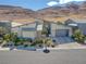 Modern home with gray roof and landscaping, mountain backdrop at 10271 Meridian Hill Ave, Las Vegas, NV 89135