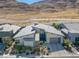 Aerial view of modern house with desert landscaping and mountain views at 10271 Meridian Hill Ave, Las Vegas, NV 89135