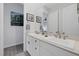 Double vanity bathroom with modern white cabinets and brushed nickel fixtures at 10271 Meridian Hill Ave, Las Vegas, NV 89135