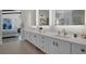 Bathroom with double vanity and modern gold fixtures at 10271 Meridian Hill Ave, Las Vegas, NV 89135