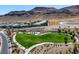 Aerial view of a community park with a grassy area, gazebo, and walking paths at 10271 Meridian Hill Ave, Las Vegas, NV 89135