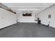 Garage with overhead storage and epoxy flooring at 10271 Meridian Hill Ave, Las Vegas, NV 89135