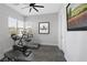 Home gym with wood-look floors, exercise bike, and treadmill at 10271 Meridian Hill Ave, Las Vegas, NV 89135