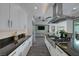 Modern kitchen with white cabinets, granite countertops and stainless steel appliances at 10271 Meridian Hill Ave, Las Vegas, NV 89135