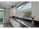 Kitchen sink and counter with modern fixtures and cabinetry at 10271 Meridian Hill Ave, Las Vegas, NV 89135