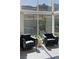 Bright sitting area with two chairs and mountain views at 10271 Meridian Hill Ave, Las Vegas, NV 89135