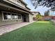 Landscaped backyard with putting green and patio at 10273 Aragon Crown Rd, Las Vegas, NV 89135