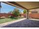 Cozy backyard featuring a brick patio and planting areas at 10273 Aragon Crown Rd, Las Vegas, NV 89135
