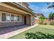 Charming backyard featuring a putting green, covered patio, and manicured landscaping at 10273 Aragon Crown Rd, Las Vegas, NV 89135