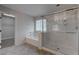 Bathroom featuring a glass-enclosed shower and soaking tub combination at 10273 Aragon Crown Rd, Las Vegas, NV 89135