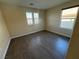 Bright bedroom featuring wood-look floors and large window at 10273 Aragon Crown Rd, Las Vegas, NV 89135