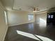 Spacious bedroom with wood-look floors and large windows at 10273 Aragon Crown Rd, Las Vegas, NV 89135