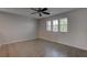 Light bedroom with wood flooring and a ceiling fan for comfort at 10273 Aragon Crown Rd, Las Vegas, NV 89135