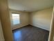 Spacious bedroom with wood-look floors and window at 10273 Aragon Crown Rd, Las Vegas, NV 89135