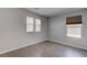 Bright bedroom featuring light wood floors, large windows, and neutral walls at 10273 Aragon Crown Rd, Las Vegas, NV 89135