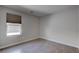 Bedroom features light wood floors and a window with light filtering shades at 10273 Aragon Crown Rd, Las Vegas, NV 89135