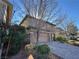 Two-story house with stone accents and a two-car garage at 10273 Aragon Crown Rd, Las Vegas, NV 89135