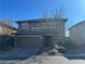 Two-story house with stone accents and a two-car garage at 10273 Aragon Crown Rd, Las Vegas, NV 89135