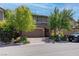 Beautiful two-story home with a well-manicured lawn and a two-car garage at 10273 Aragon Crown Rd, Las Vegas, NV 89135
