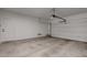 Clean and empty two car garage with door to the interior at 10273 Aragon Crown Rd, Las Vegas, NV 89135
