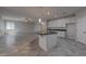 Open floor plan with an island separating the kitchen and living area at 10273 Aragon Crown Rd, Las Vegas, NV 89135