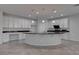 Modern kitchen featuring white cabinets, granite countertops, and stainless steel appliances at 10273 Aragon Crown Rd, Las Vegas, NV 89135