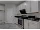 Updated kitchen featuring stainless steel appliances and sleek white cabinets at 10273 Aragon Crown Rd, Las Vegas, NV 89135